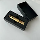 Round brass hand roller with rolling paper